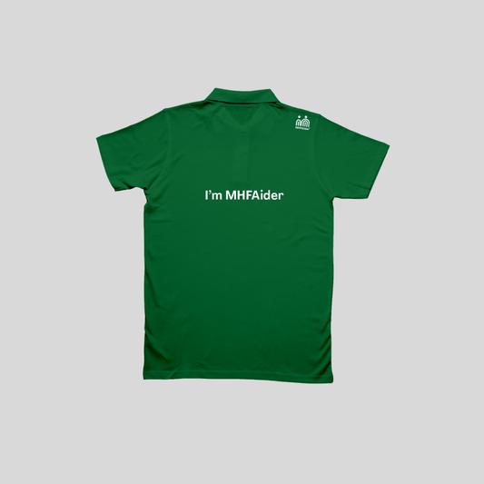 A green short-sleeve polo shirt shown from the back, featuring the white text 'I'm MHFAider' across the center and a small white MHFAider logo on the upper right shoulder, set against a solid gray background.