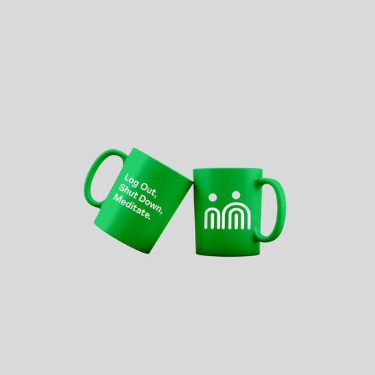 Two bright green ceramic mugs shown on a plain light gray background. One mug is tilted and displays the white text 'Log Out, Shut Down, Meditate.