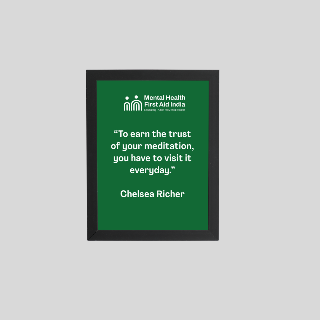 A framed motivational quote print featuring a green background with white text. The top displays the Mental Health First Aid India logo, and the quote reads, 'To earn the trust of your meditation, you have to visit it everyday.